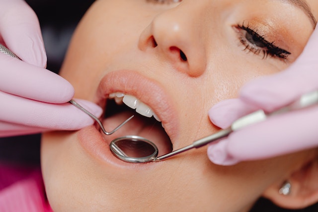 a woman during a dental cleaning procedure