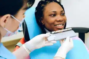a woman choosing a dental implant