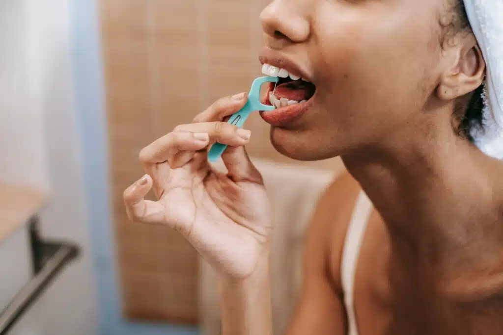 a woman flossing