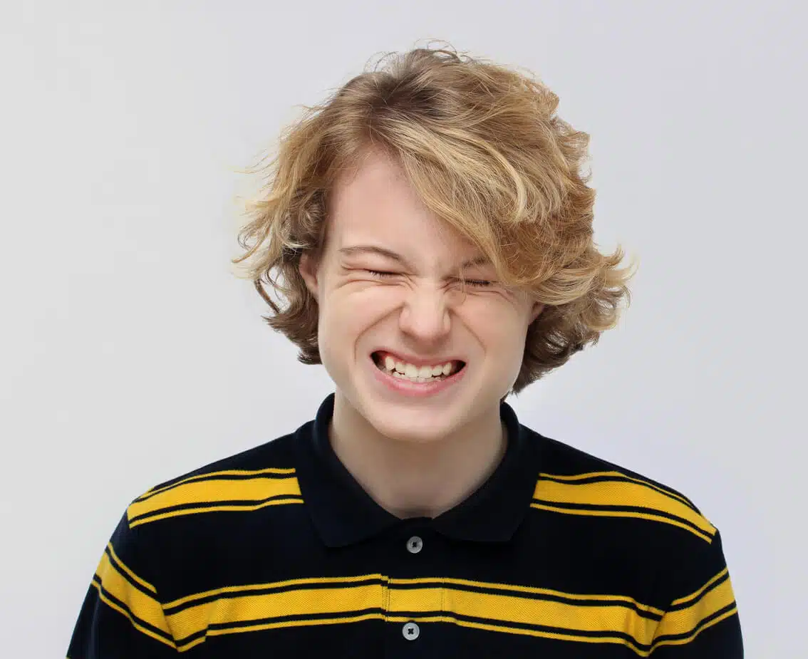 a young man grinding teeth