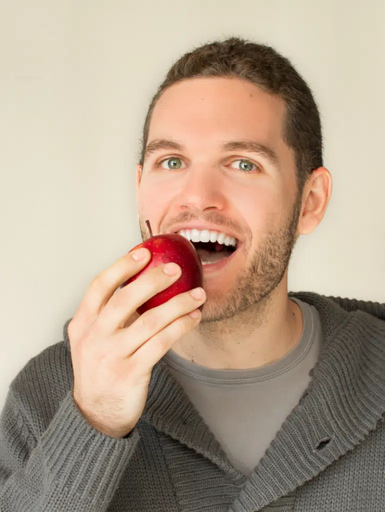 teeth implants eating apples